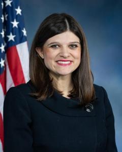 Rep. Stevens next to the American Flag