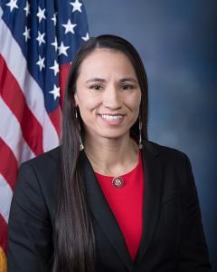 Rep. Davids next to the American Flag
